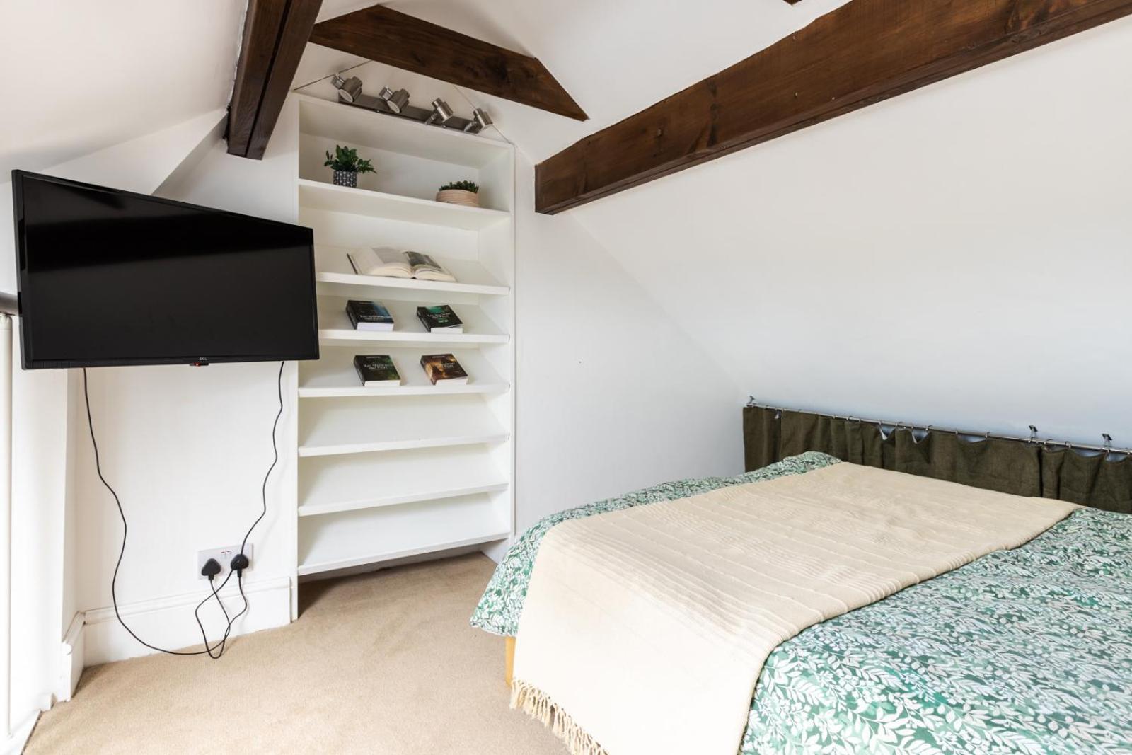 En-suite With Double Bed On Mezzanine And Desk In Family